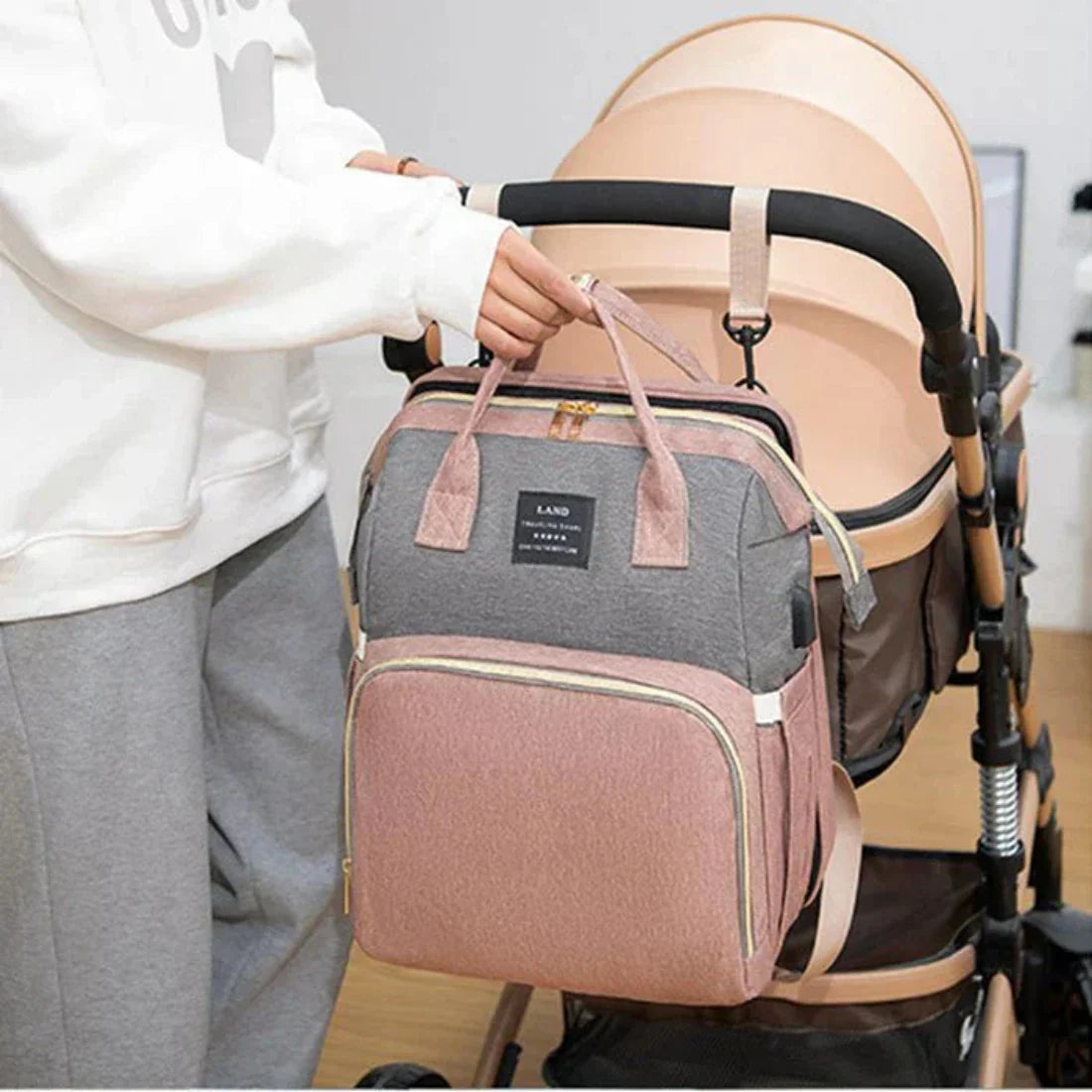 Icone™ MommyBag: Bärbar Väska med Magisk Fällbar Spjälsäng